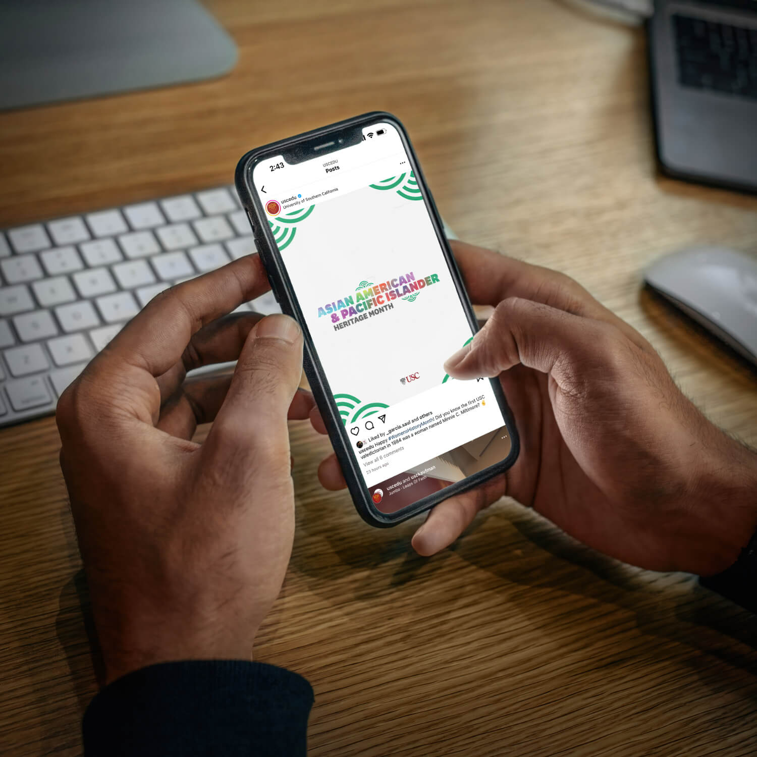 Phone mock-up featuring a student browsing the USC Instagram page adorned with AAPI graphics, highlighting Asian American and Pacific Islander heritage.