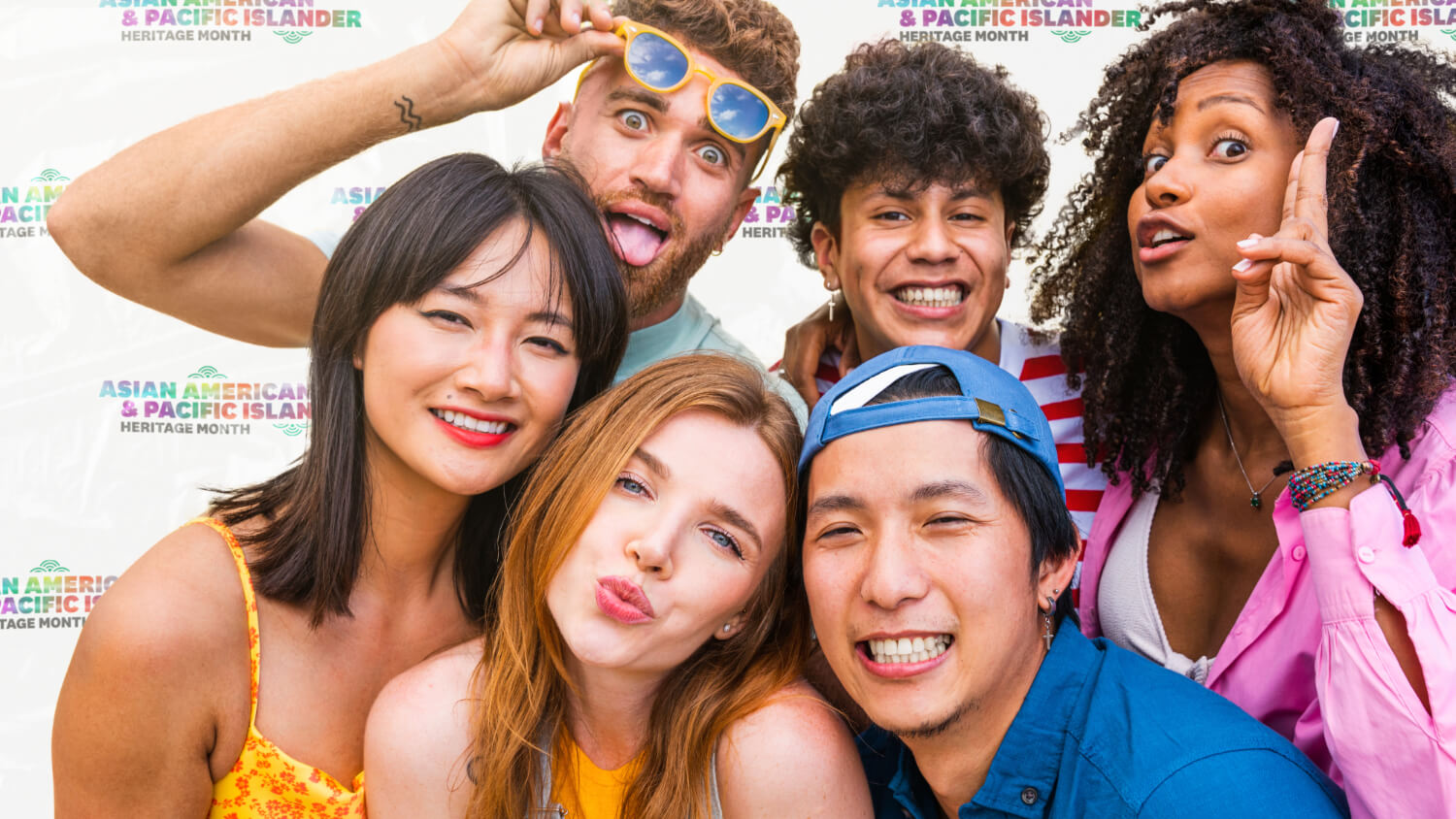 Mock-up of a group of students photographed in front of an AAPI step-and-repeat logo lock-up, highlighting Asian American and Pacific Islander heritage.